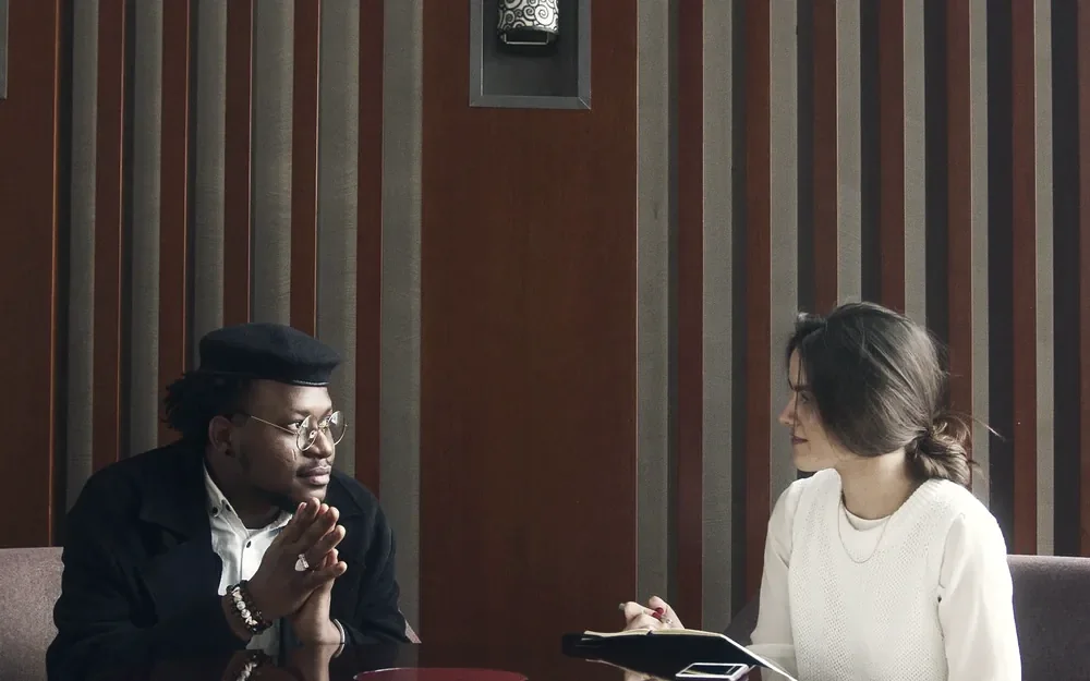 Two people in a focused, respectful business conversation