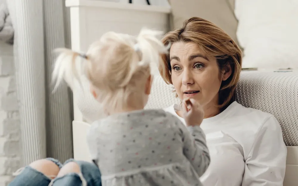 A parent and child in a warm, calm moment at home